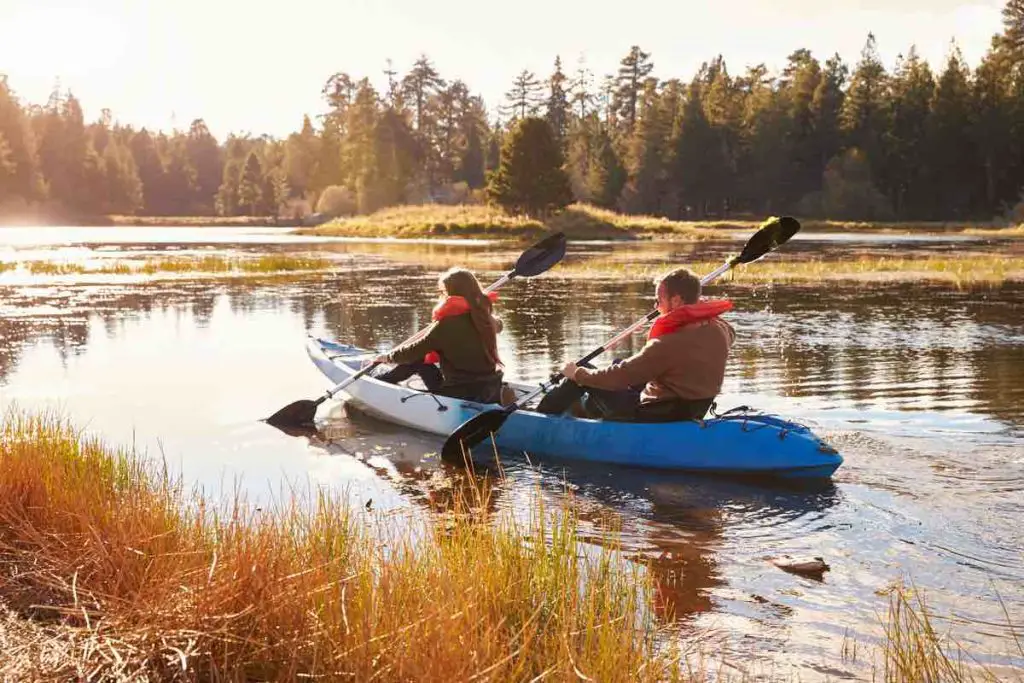 Couple kayaking on lake, back view, Big Bear, California