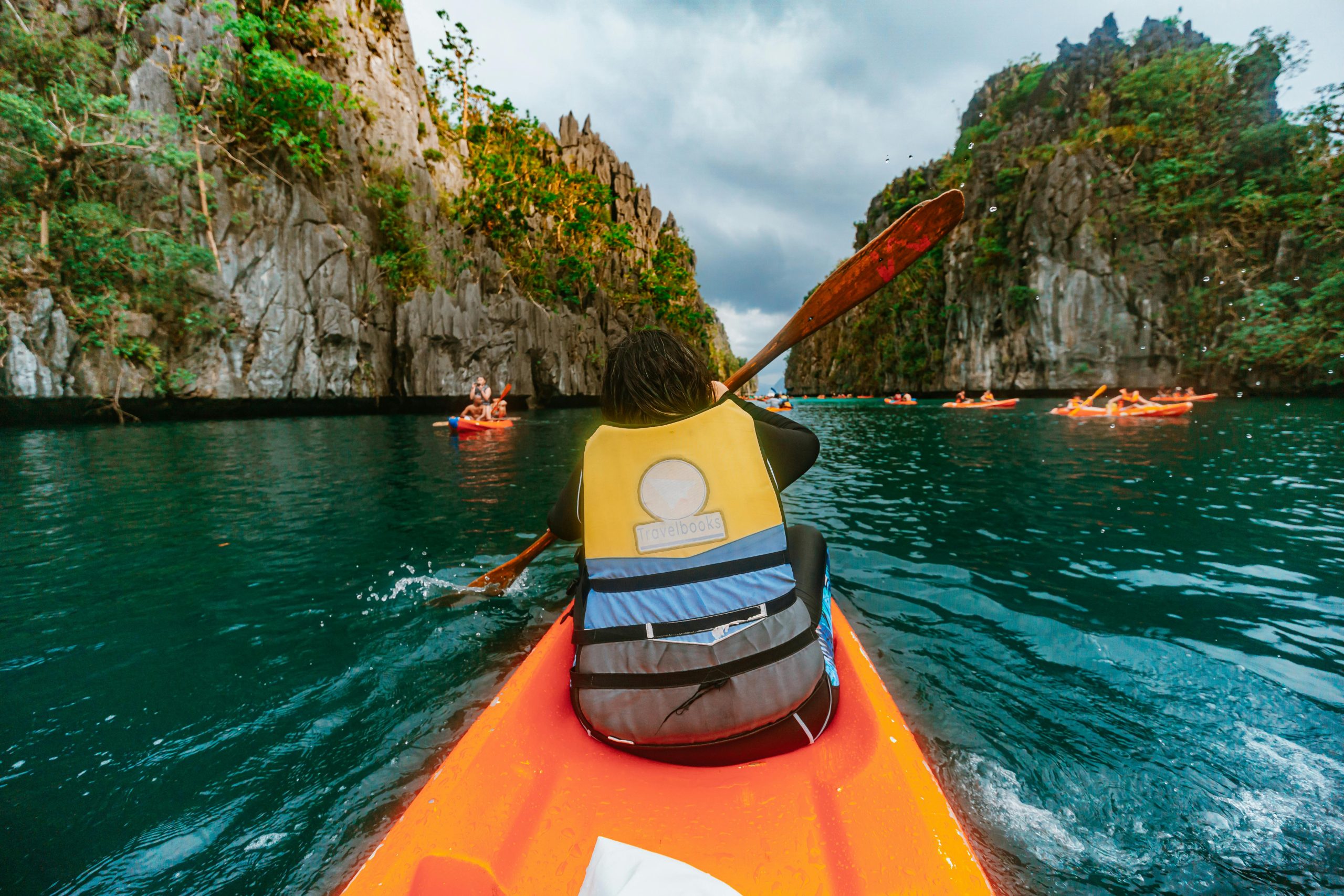 Experience the thrill of kayaking through El Nido's breathtaking limestone formations.